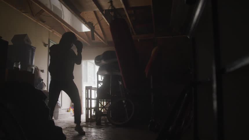 A man punching a punching bag