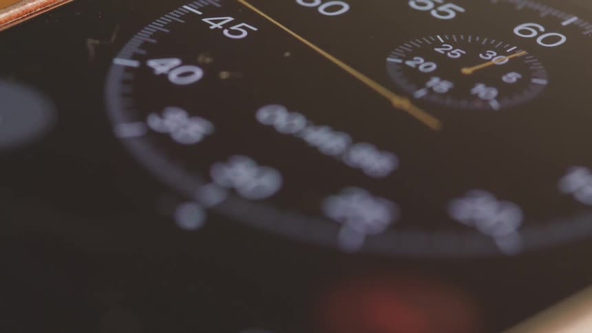 Needle moves around analog speedometer