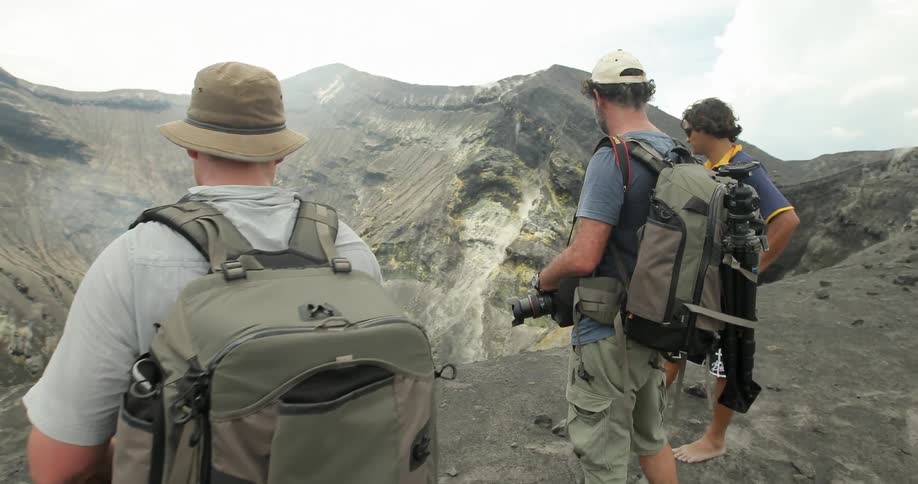 Explorers Climbing Volcano