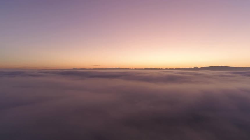 Cumulus clouds until the horizon at sunset