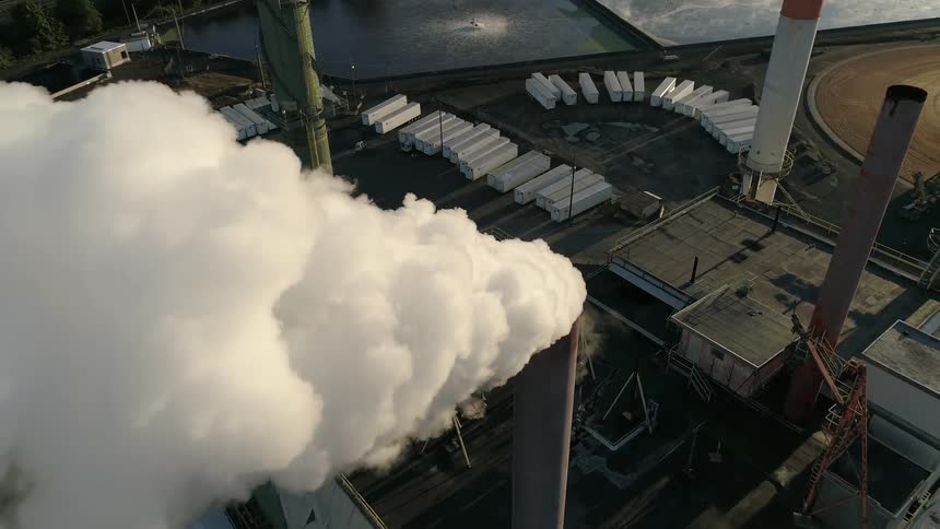 A factory chimney billowing smoke