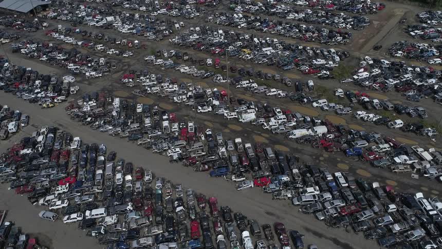 An aerial view of a car lot is displayed