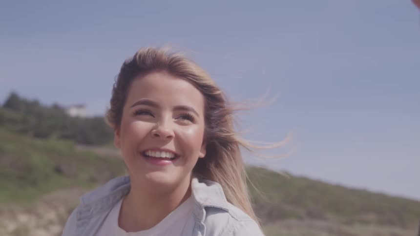 A young girls smiles and looks at her boyfriend