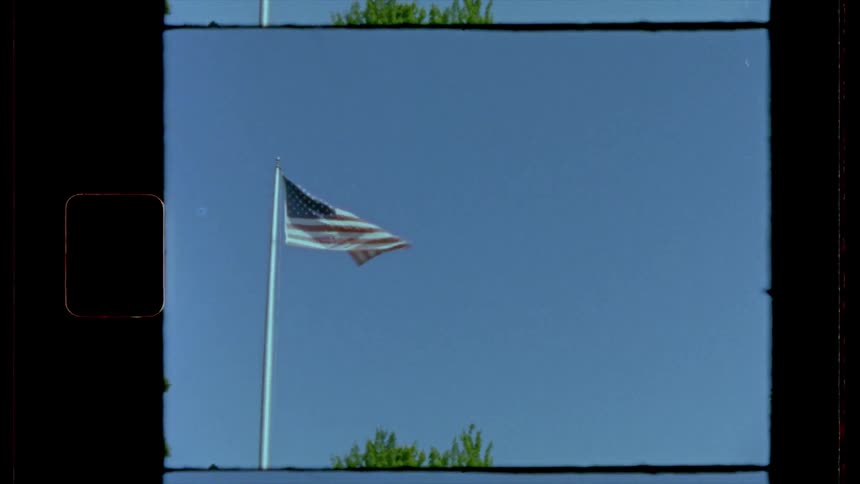 A vintage footage of waving american flag