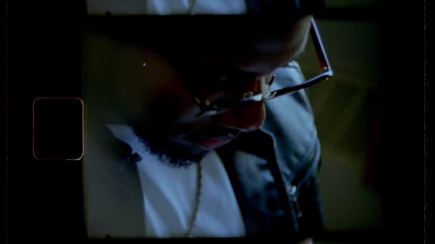 Film footage of a black man looking down