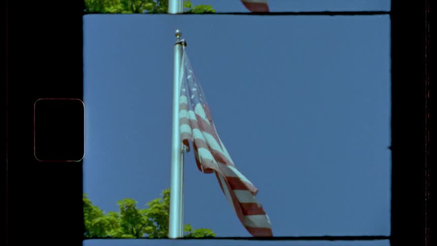 A vintage footage of a waving american flag