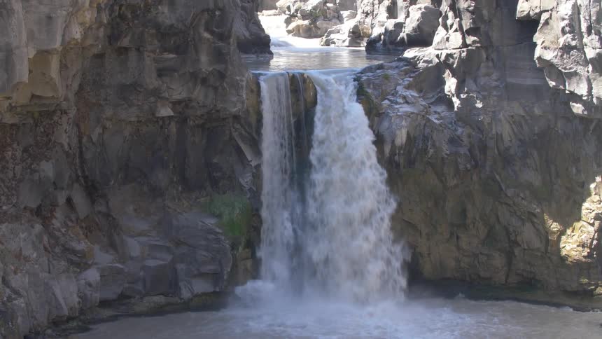 The waterfall is pouring off the stream