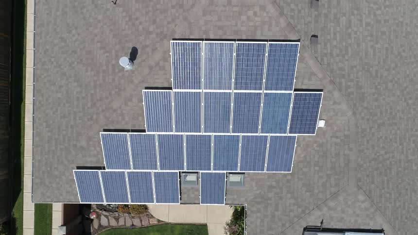 An aerial view of solar panel on top of the roof