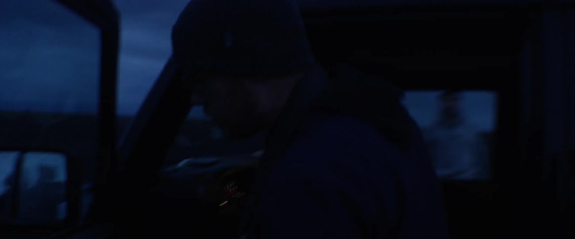 Two people are getting into a vehicle