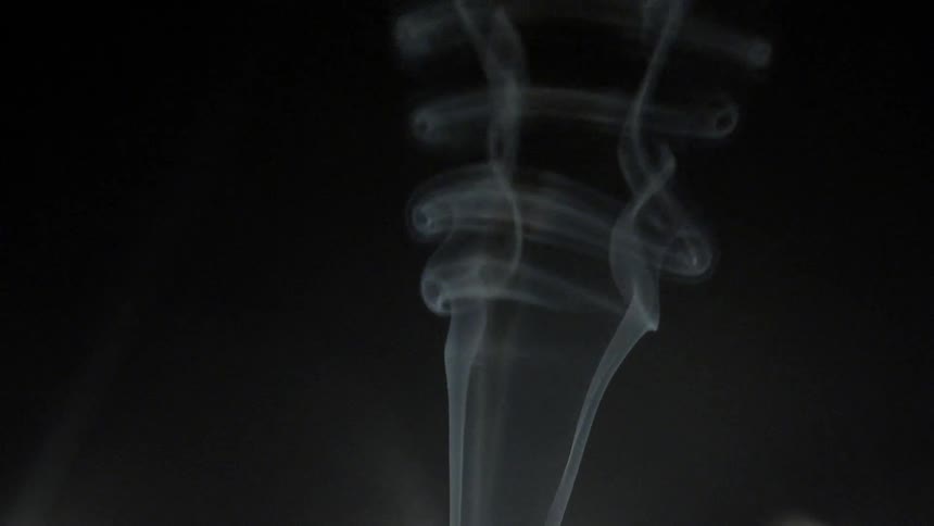 Smoke rising up in to the darkness