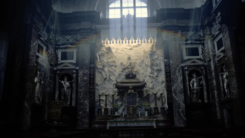 The inside of a church with statues crosses and architectural design