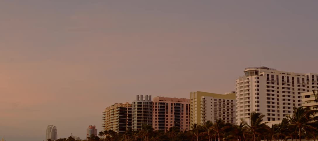 A scenery of high rise building at sunset