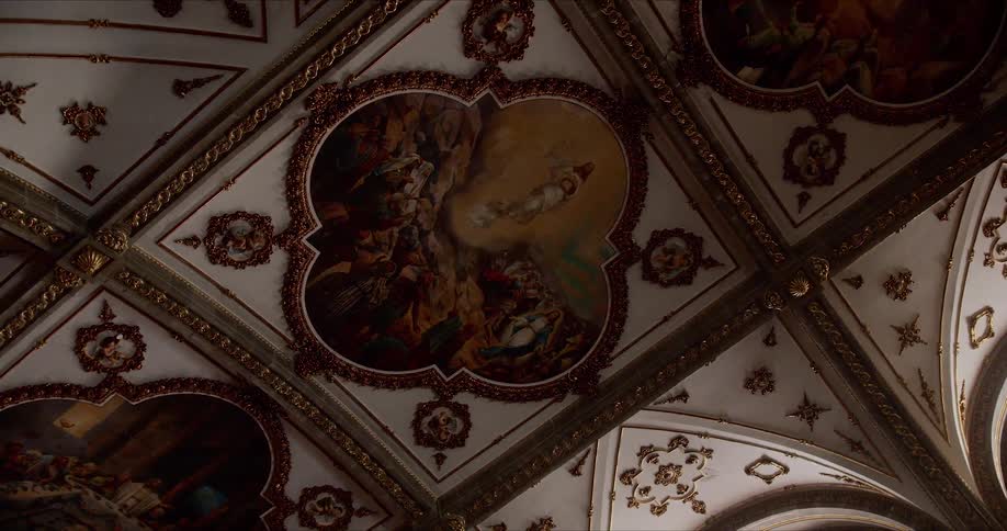 Elaborate decorations and paintings cover high ceiling