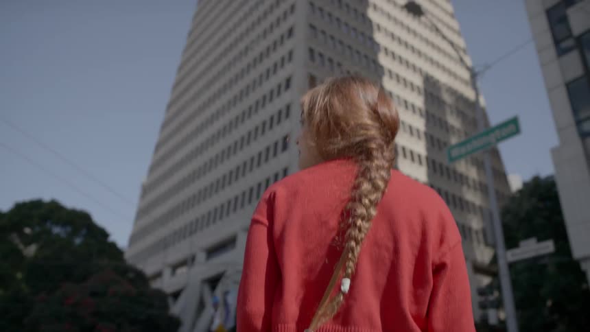 A woman walks across the street
