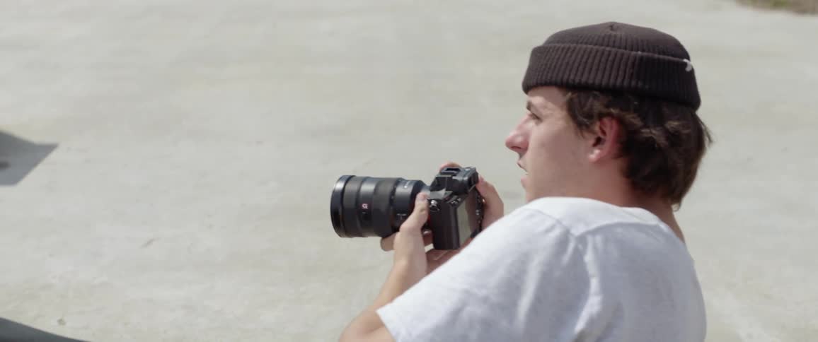 Photographer lies on ground to get a shot