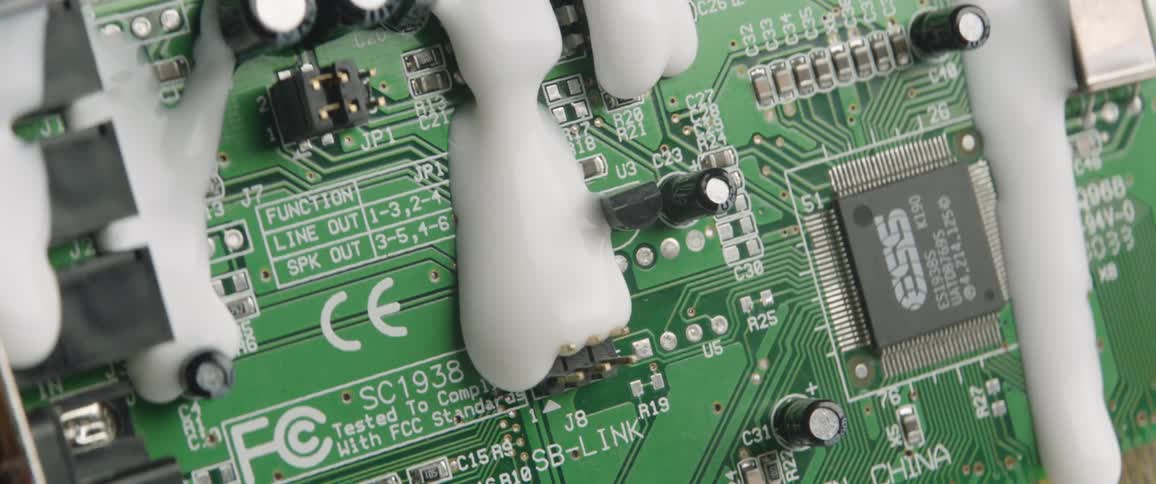 White paint drips down a circuit board