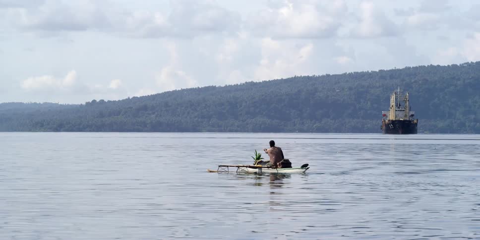 A person sitting in a canoe