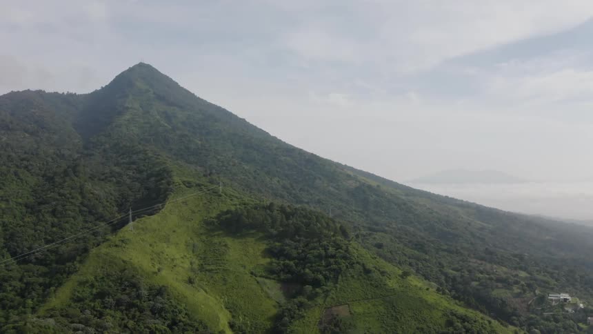 A hill with the sky in the background