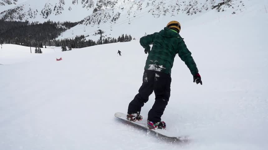 A person snowboarding down a mountain