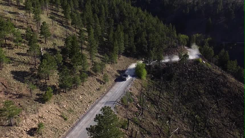 A car driving in the mountains