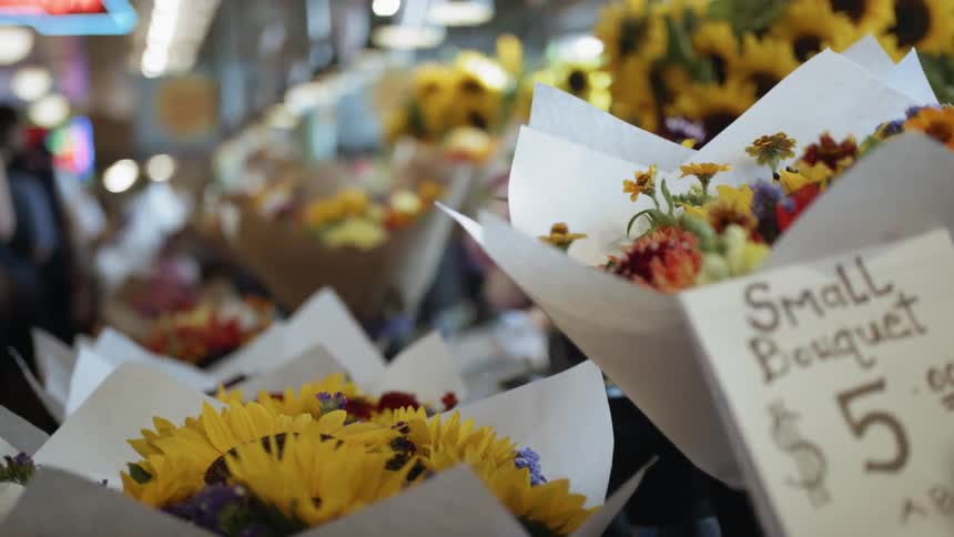 People walk in a flower market