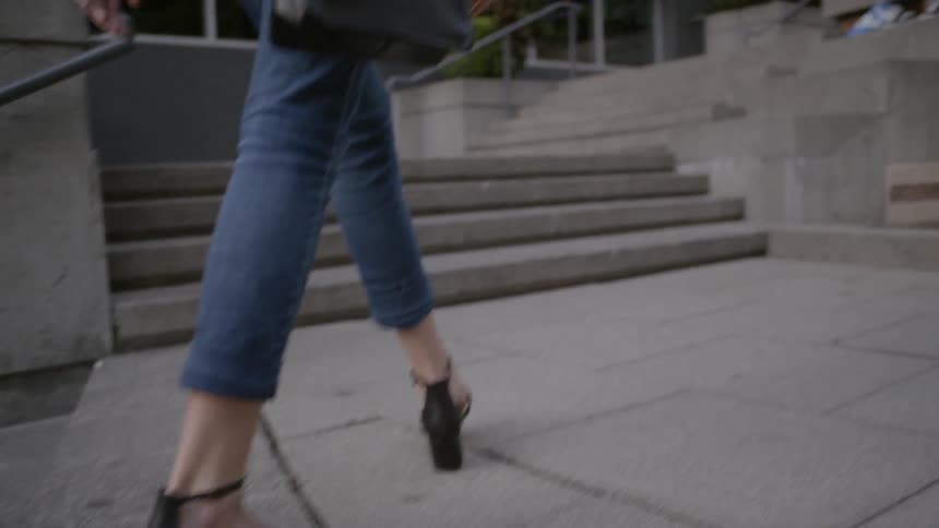 A footage of woman walks on the stair