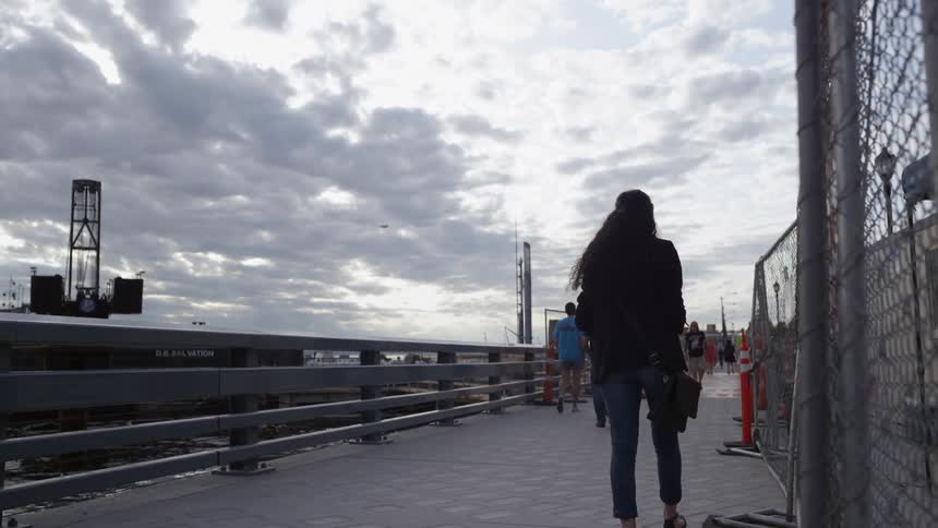 A woman walks in the pedestrian