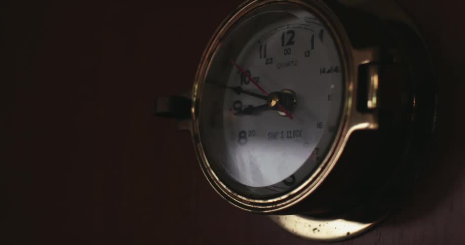Close up of wall mounted brass clock
