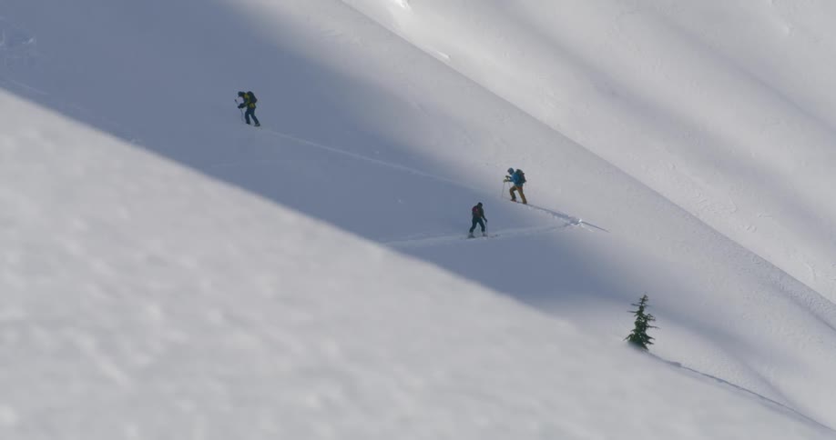 People playing snow board on the snow hill
