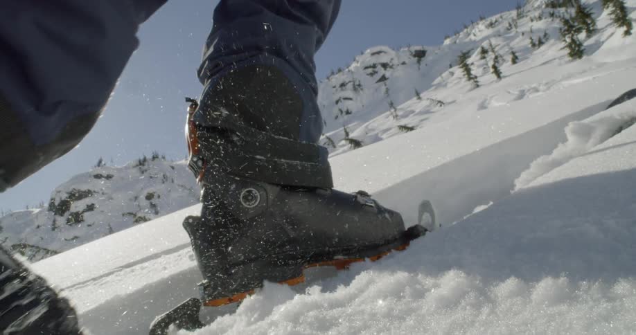 A person is skiing up a mountain