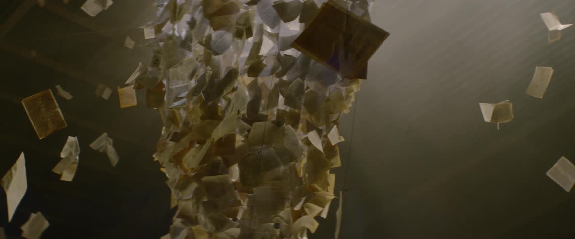 Papers hang from the ceiling