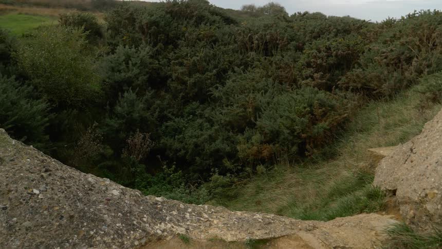 A drone footage of a rock and foreset