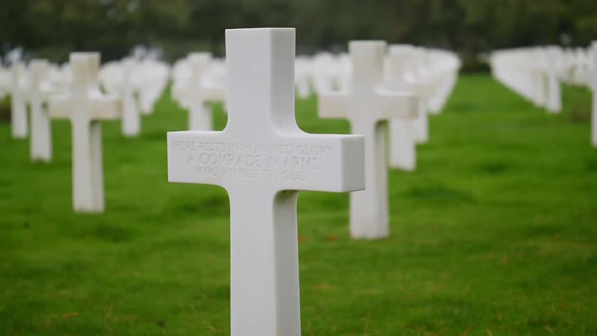 The cemetery is lined with white crosses