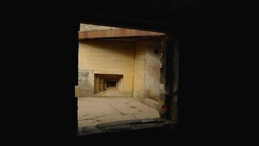 A view from an open door is displayed and looking at a house