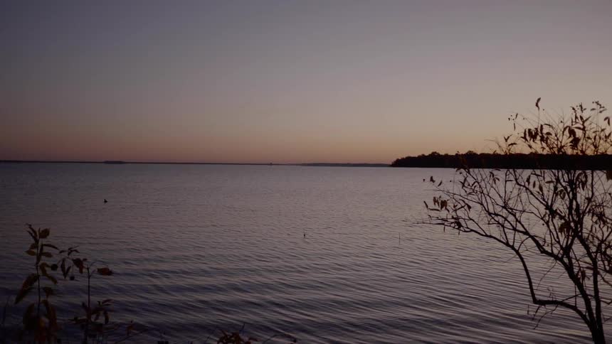 Waves roll in over a lake