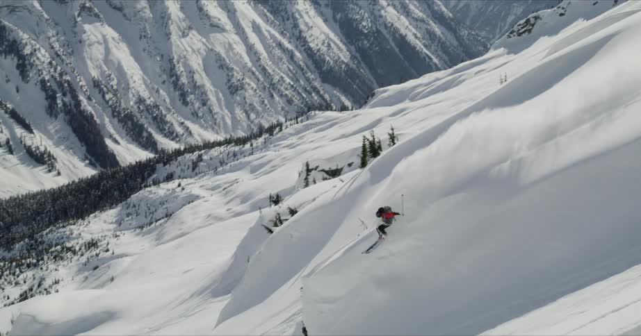 A person is skiing down a snowy mountain