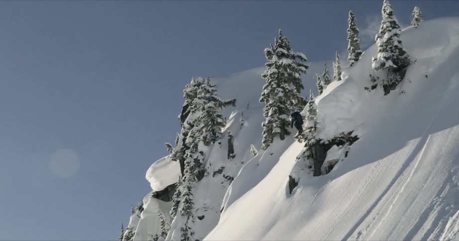 A man falling while skiing on the mountain