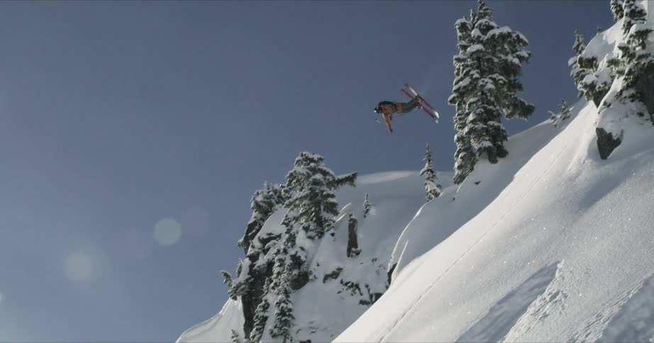 A man jumping with ski on the mountain