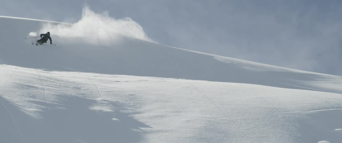 A man doing a snow boarding on the clear day