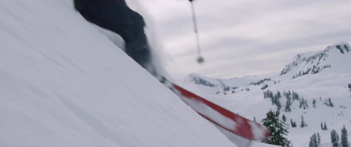 A scenery of a man doing a downhill on the snowy hill
