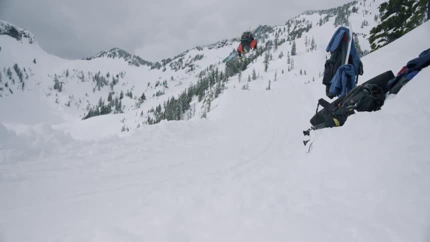 A man doing a snow board trick