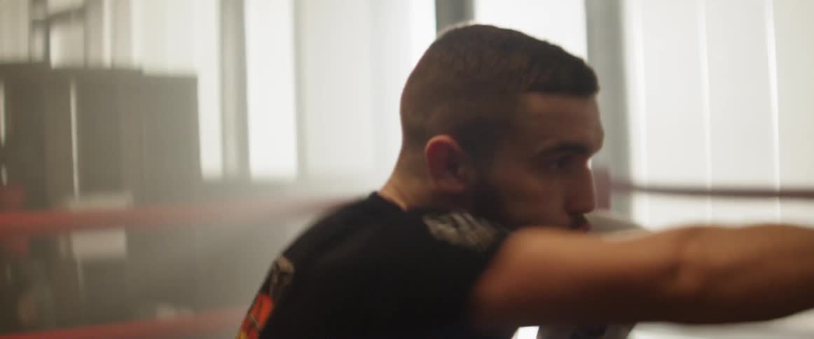 A man boxes another