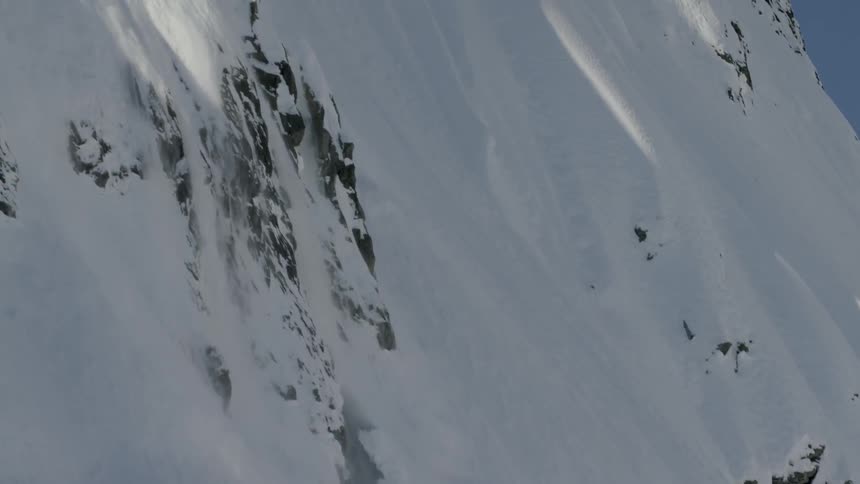 A scenery of an avalanceh on the slopy mountain