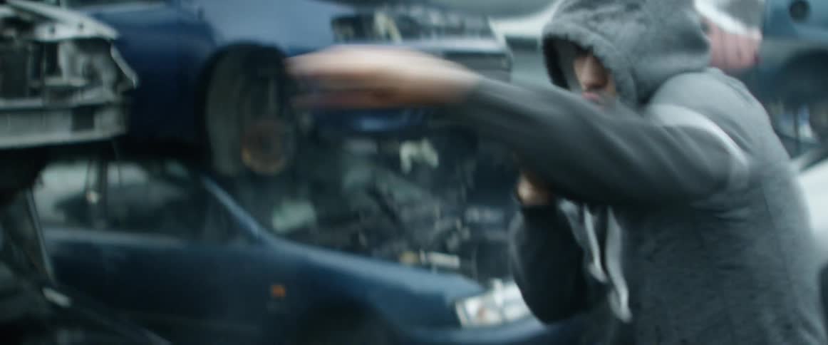 A man with hoodie doing a shadow boxing