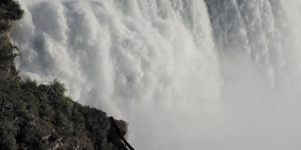 Waterfall fiercely rushing down the canyon