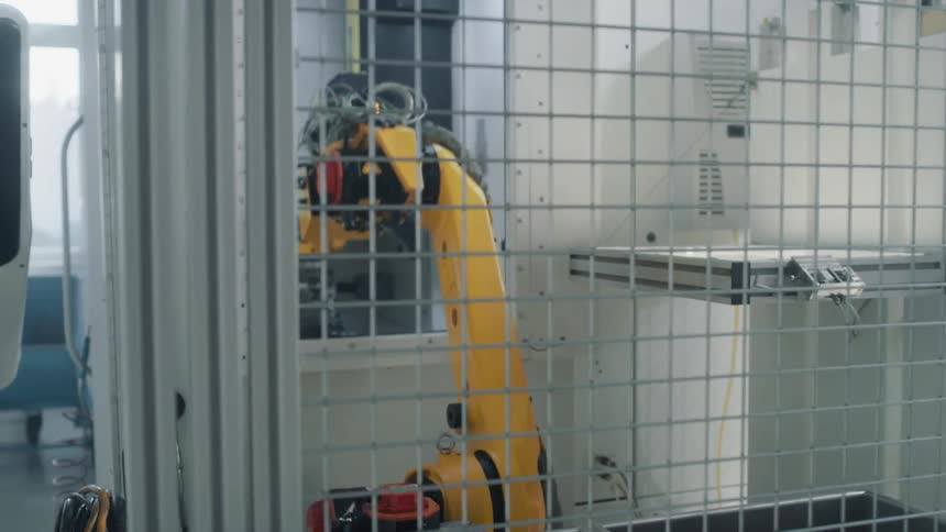 A scenery of a robotic arm in action at the laboratory