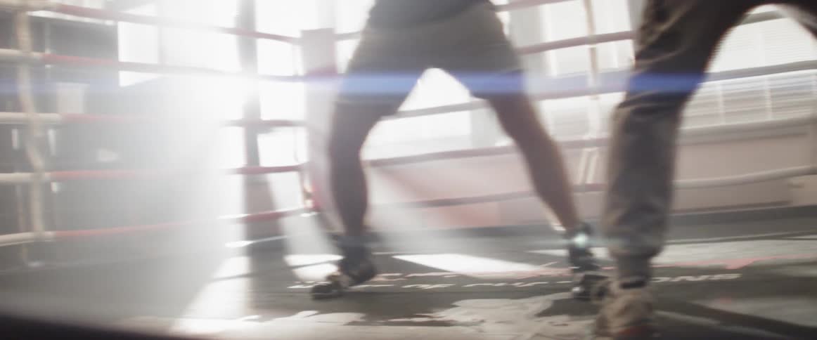 Men doing boxing on the ring