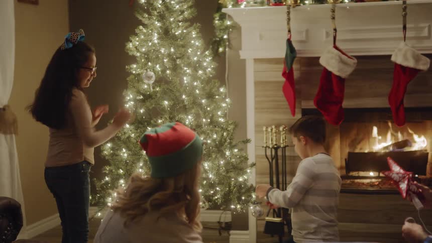 A family celebrating christmas on their home