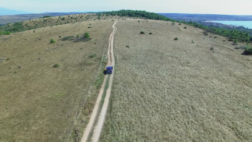 A car drives down the road