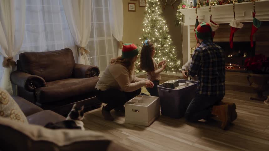 A family decorates for the holiday